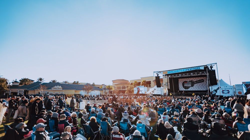 A crowd fills the main stage lawn at the 30A Songwriters Festival