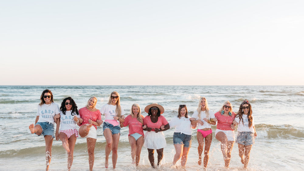 Friends on the beach in 30A apparel made from recycled bottles