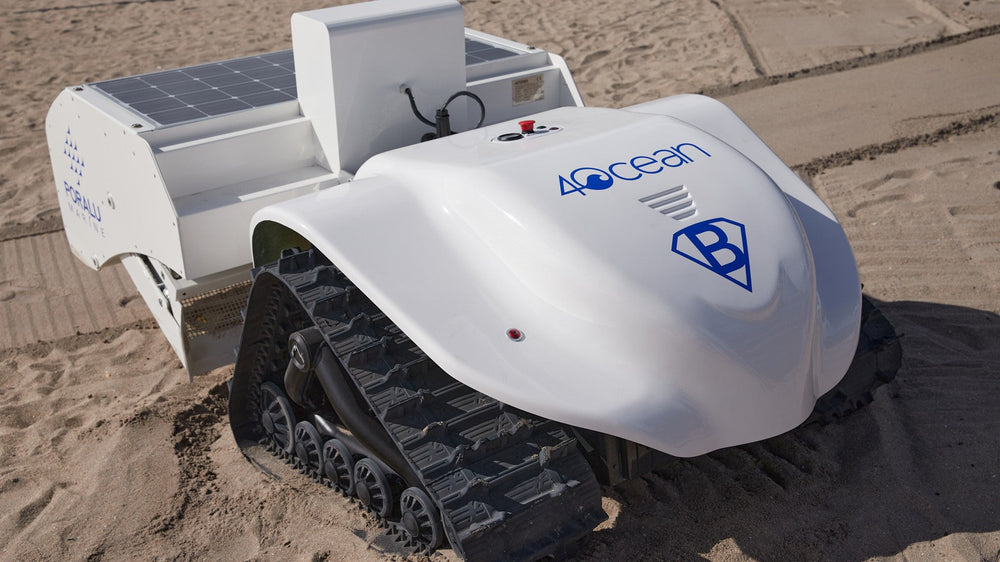 The BeBot beach-cleaning robot on its tank tracks in the sand