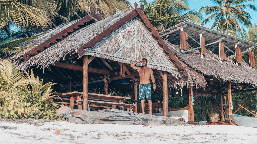 The thatched Bilou beach bar standing above the white sand of Awera Island