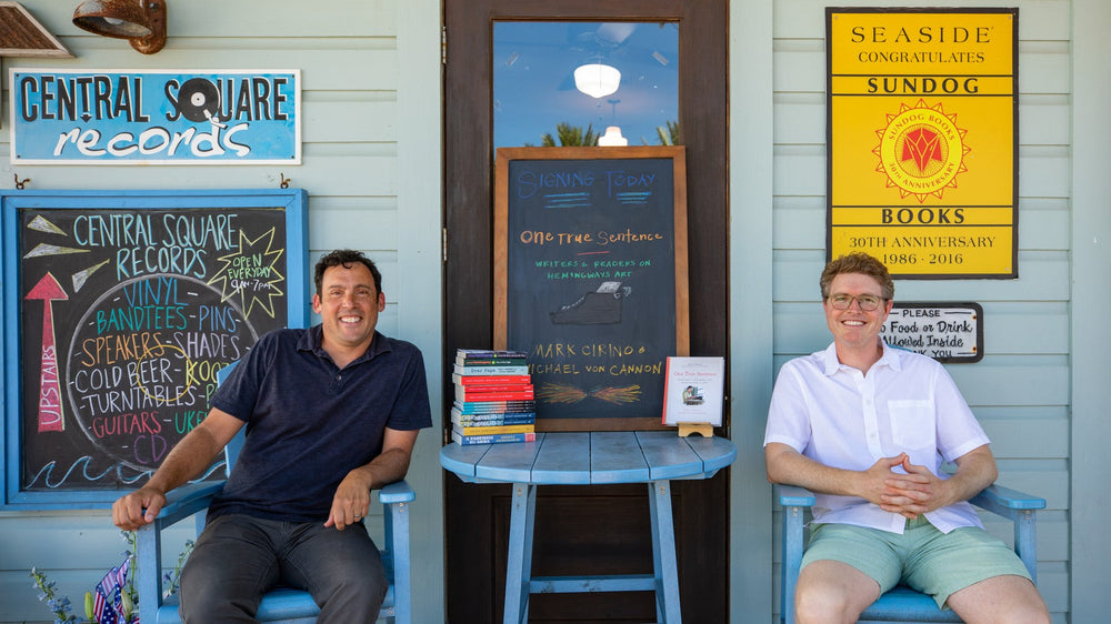 Mark Cirino and Michael Von Cannon seated outside Sundog Books in Seaside