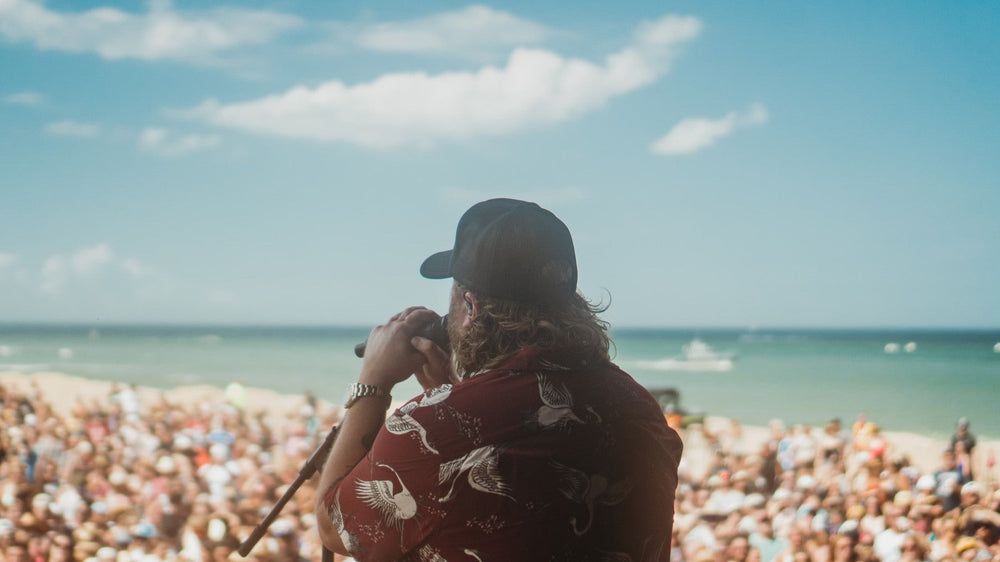 Nate Smith performing on the beach