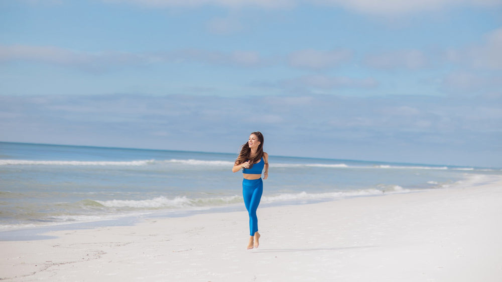 Jessica Fay walking on the beach along 30A