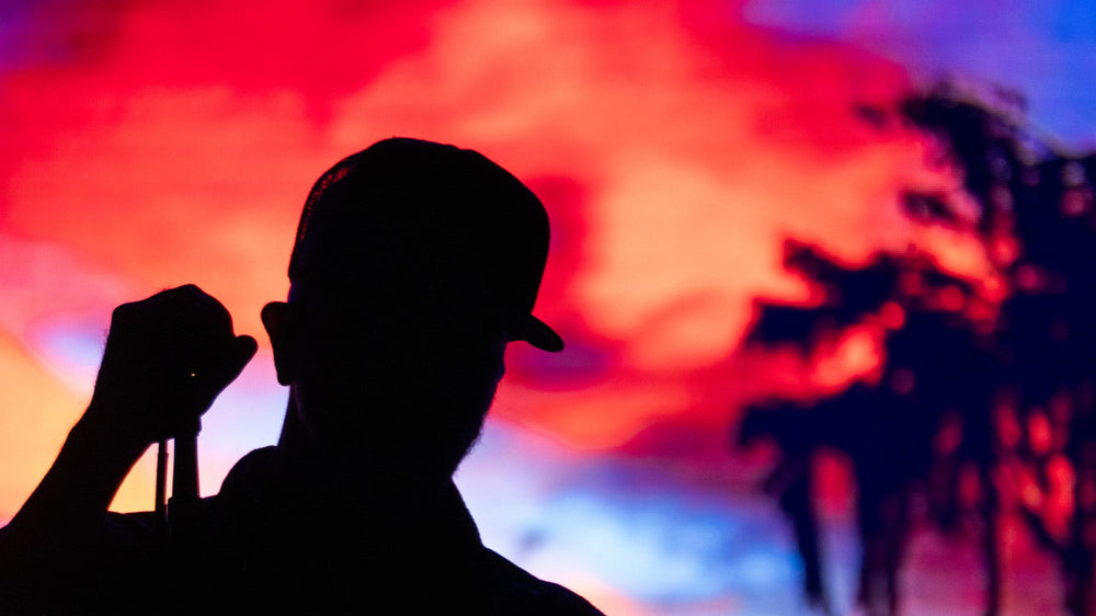 JJ Grey silhouetted onstage