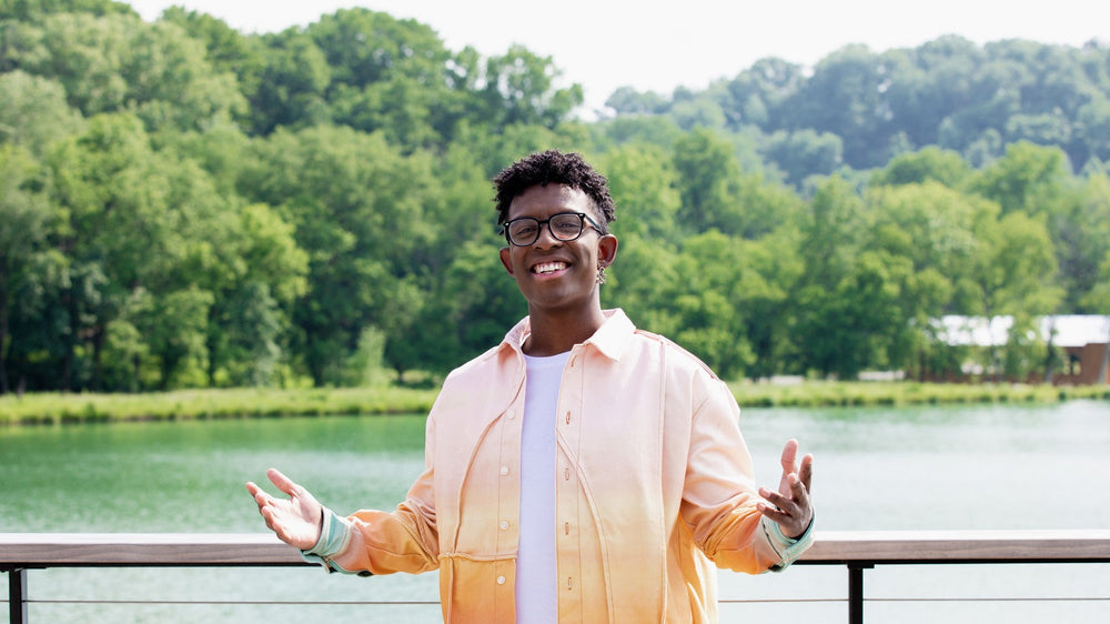 BRELAND outdoors by the water