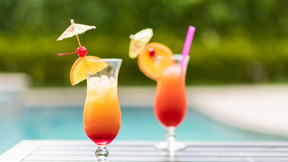 Two tropical cocktails poolside